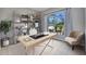 Bright home office featuring a modern desk, stylish shelving, and a large window with a view at 1962 Remus Ave, North Port, FL 34286