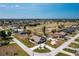 Desirable neighborhood with golf course views, showcasing a well-maintained home with lush landscaping at 204 Bunker Rd, Rotonda West, FL 33947