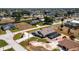 Aerial view of a beautiful property with a pool and well-manicured landscaping in a quiet neighborhood at 204 Bunker Rd, Rotonda West, FL 33947