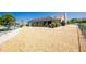 Well-maintained backyard features rock landscape and pool with privacy at 204 Bunker Rd, Rotonda West, FL 33947