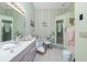 This bathroom features double sinks, walk-in shower and bath tub at 204 Bunker Rd, Rotonda West, FL 33947