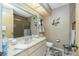 Full bathroom featuring a large mirror, vanity, toilet, and shower at 204 Bunker Rd, Rotonda West, FL 33947