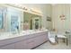Bright bathroom boasts a double vanity, soaking tub, and walk-in shower at 204 Bunker Rd, Rotonda West, FL 33947