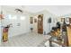 Bright foyer showcasing a tile floor, double doors, and classic decorative elements creating an inviting entrance at 204 Bunker Rd, Rotonda West, FL 33947