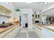 Bright kitchen with white cabinets, a cooktop, and plenty of counter space at 204 Bunker Rd, Rotonda West, FL 33947