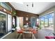 Enclosed patio with tile floors, skylights, and views of the lush surroundings at 204 Bunker Rd, Rotonda West, FL 33947
