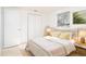 Bright bedroom featuring neutral tones, natural light, and minimalist decor at 2075 Georgia Ave, Englewood, FL 34224