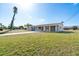Charming single-story home with a spacious front yard and a long driveway, perfect for Gathering living at 2075 Georgia Ave, Englewood, FL 34224