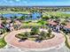 Beautiful entrance to Sarasota National community with manicured landscaping and water feature at 23590 Copperleaf Dr, Venice, FL 34293