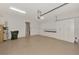 Spacious two car garage with epoxy floors and ample built in cabinet storage at 23590 Copperleaf Dr, Venice, FL 34293
