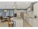 Gourmet kitchen featuring stainless steel appliances, granite countertops, and a spacious center island at 23590 Copperleaf Dr, Venice, FL 34293