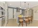 Well-equipped kitchen with a large island, modern appliances, and stylish finishes throughout at 23590 Copperleaf Dr, Venice, FL 34293