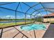 Screened-in pool with spa and beautiful views of the pond at 23590 Copperleaf Dr, Venice, FL 34293