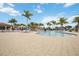 Large community pool with plenty of lounge seating and umbrellas for relaxation at 23590 Copperleaf Dr, Venice, FL 34293