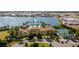 Beautiful aerial view showcasing the community's pool, lake, and tennis courts at 257 Corelli Dr, Nokomis, FL 34275