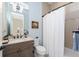 Well-appointed bathroom features granite countertops, a bathtub with shower, and neutral tiling at 257 Corelli Dr, Nokomis, FL 34275