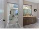 Elegant bathroom featuring a double vanity, soaking tub, and neutral color palette at 257 Corelli Dr, Nokomis, FL 34275