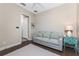 Bedroom featuring a comfortable sofa and stylish side table, perfect for relaxing at 257 Corelli Dr, Nokomis, FL 34275