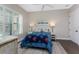 Cozy bedroom with plantation shutters, ceiling fan, neutral walls, and hardwood floors at 257 Corelli Dr, Nokomis, FL 34275