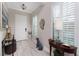 Bright foyer with tile flooring, and a decorative console table at 257 Corelli Dr, Nokomis, FL 34275