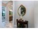 Hallway featuring a decorative table with modern decor and a bathroom view at 257 Corelli Dr, Nokomis, FL 34275