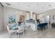 Elegant kitchen featuring an island with seating, stainless appliances, and adjacent breakfast nook at 257 Corelli Dr, Nokomis, FL 34275