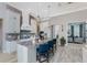 Kitchen with an island, granite countertops, stainless appliances, and modern lighting at 257 Corelli Dr, Nokomis, FL 34275