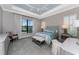 Luxurious bedroom with tray ceiling, soft carpet, and a serene color scheme at 257 Corelli Dr, Nokomis, FL 34275