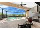 Screened patio with beautiful pool, spa, outdoor kitchen and lovely lake view at 257 Corelli Dr, Nokomis, FL 34275