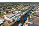 Aerial view of home with a pool, boat dock and canal access at 2673 Titania Rd, Englewood, FL 34224