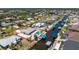 Expansive aerial view showcases a waterfront property with a private pool and boat dock on a scenic canal at 2673 Titania Rd, Englewood, FL 34224