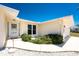 The front entryway features a glass-paneled front door and well-kept landscaping at 2673 Titania Rd, Englewood, FL 34224