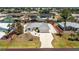 Charming single-story home features a manicured front yard, long driveway and an attached garage at 2673 Titania Rd, Englewood, FL 34224