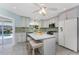 Beautiful kitchen featuring marble countertops, stainless appliances, and a view of the pool at 2673 Titania Rd, Englewood, FL 34224