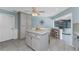 The kitchen features marble countertops, stainless appliances, and is open to the living area at 2673 Titania Rd, Englewood, FL 34224