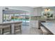 Spacious eat-in kitchen features marble countertops and a stainless steel dishwasher at 2673 Titania Rd, Englewood, FL 34224