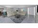Inviting living room with a large sectional, a decorative rug, and plenty of natural light at 2673 Titania Rd, Englewood, FL 34224