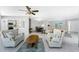Spacious living area with sectional seating, tile floors and open to dining and kitchen at 2673 Titania Rd, Englewood, FL 34224