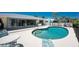 Stunning pool with sunny patio and backyard offers seamless indoor/outdoor living at 2673 Titania Rd, Englewood, FL 34224