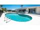 Gorgeous kidney-shaped pool and patio provides a private backyard retreat at 2673 Titania Rd, Englewood, FL 34224
