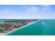 Gorgeous aerial view of beachfront condos along the pristine turquoise waters of the Gulf Coast at 2950 N Beach Rd # B324, Englewood, FL 34223