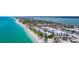 Panoramic aerial view of beachfront condos with sparkling turquoise water at 2950 N Beach Rd # B324, Englewood, FL 34223