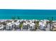 Stunning aerial view of beachfront condos with turquoise ocean backdrop at 2950 N Beach Rd # B324, Englewood, FL 34223