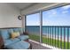 Enjoy the ocean view from this cozy balcony with comfortable seating and beach access at 2950 N Beach Rd # B324, Englewood, FL 34223