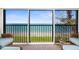 Relaxing balcony view overlooking the ocean with comfortable seating at 2950 N Beach Rd # B324, Englewood, FL 34223