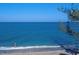 Picturesque beach view featuring clear turquoise water and sandy shore at 2950 N Beach Rd # B324, Englewood, FL 34223