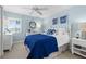 Comfortable bedroom with a queen-size bed and coastal decor at 2950 N Beach Rd # B324, Englewood, FL 34223