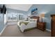 Cozy bedroom with window seat overlooking ocean, features neutral colors and ample natural light at 2950 N Beach Rd # B324, Englewood, FL 34223
