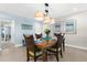 Bright dining area with seating for four and coastal decor at 2950 N Beach Rd # B324, Englewood, FL 34223