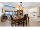Dining area with seating for four and great views of the living room, kitchen, and ocean at 2950 N Beach Rd # B324, Englewood, FL 34223